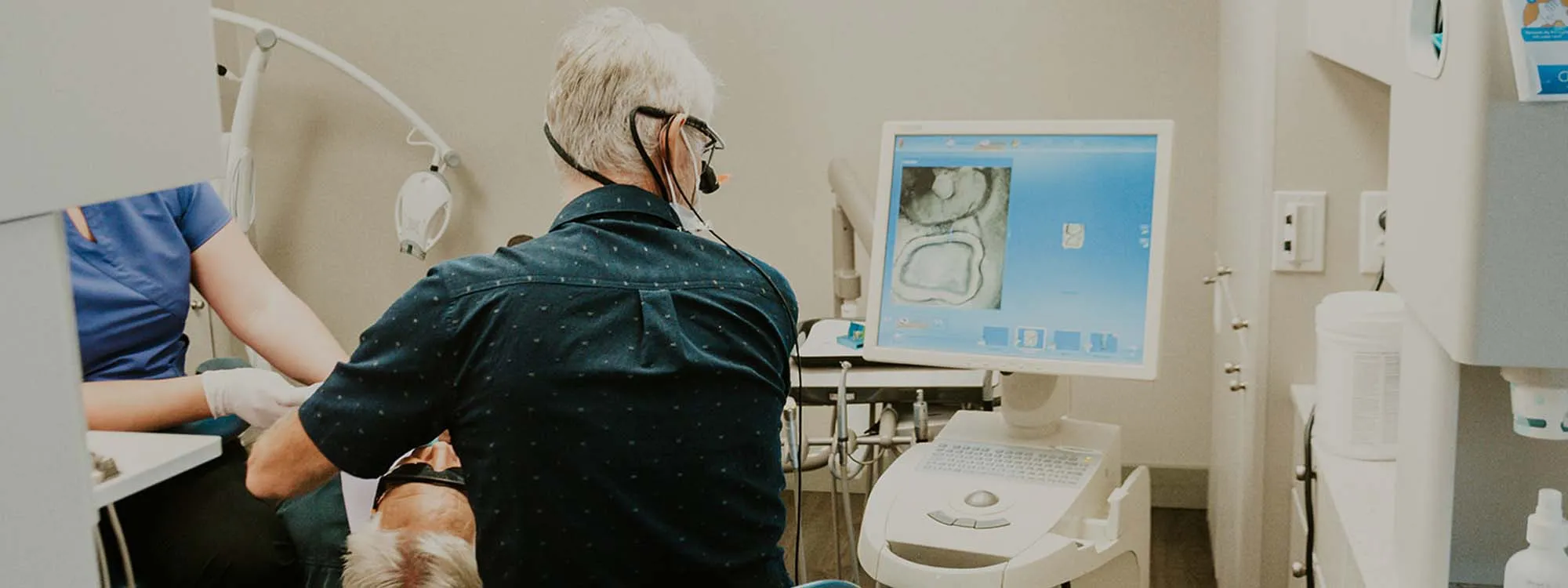 Dentist examining patient